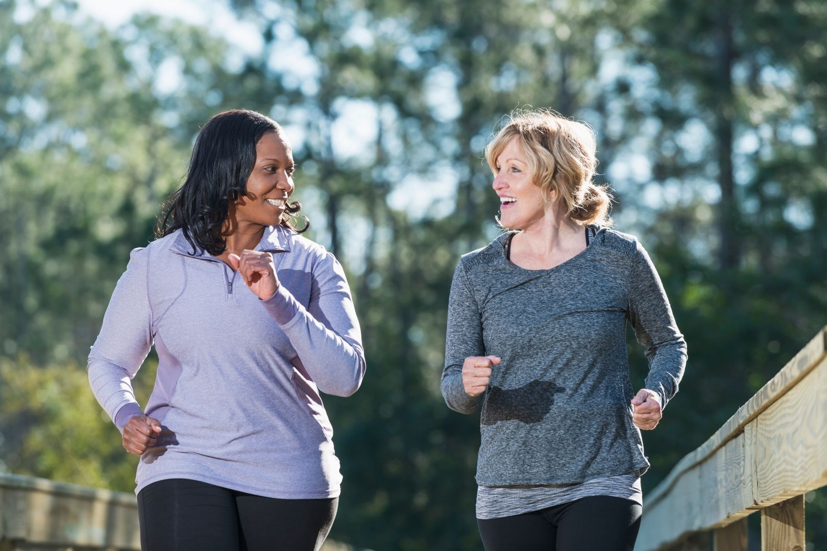 Two women walking and smiling